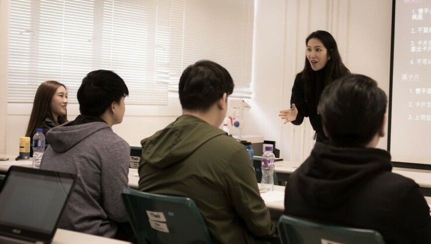 Ms. Joyce Wong, Director of Joyce Image, demonstrates how to give a handshake at the end of a job interview while she stresses on the importance of body language at the Business Etiquette and Grooming Workshop in Feb, 2017.